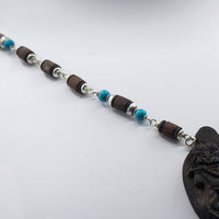 Turquoise stones Mala with Wood Carved Radha Krishna Pendant